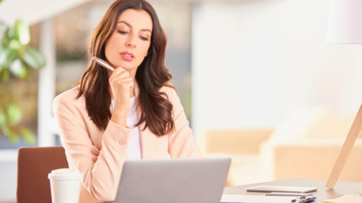 Small business owner researching digital marketing agency options on her laptop to improve online presence.