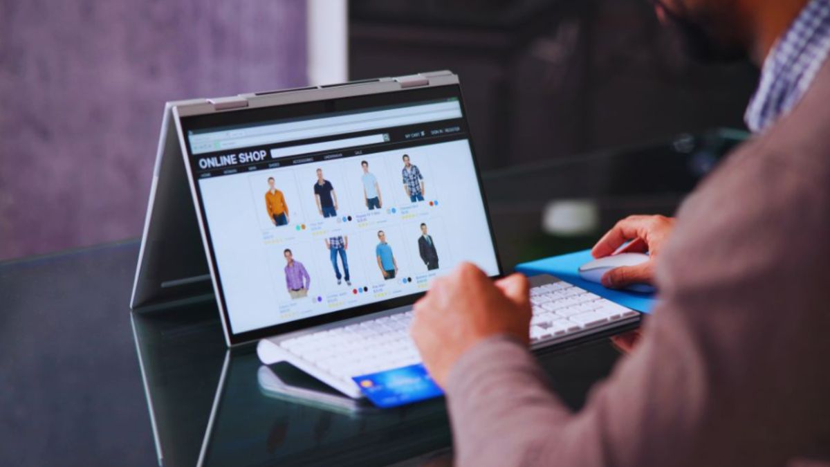 A man using a laptop, working to boost local visibility on Google with effective website photos.