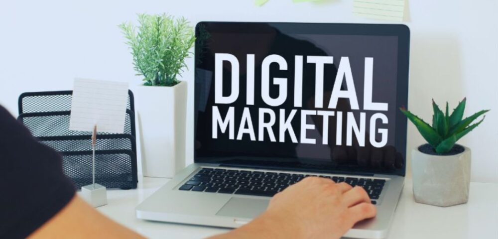Person working on a laptop displaying the words “Digital Marketing,” representing online marketing services in Palmetto Bay.