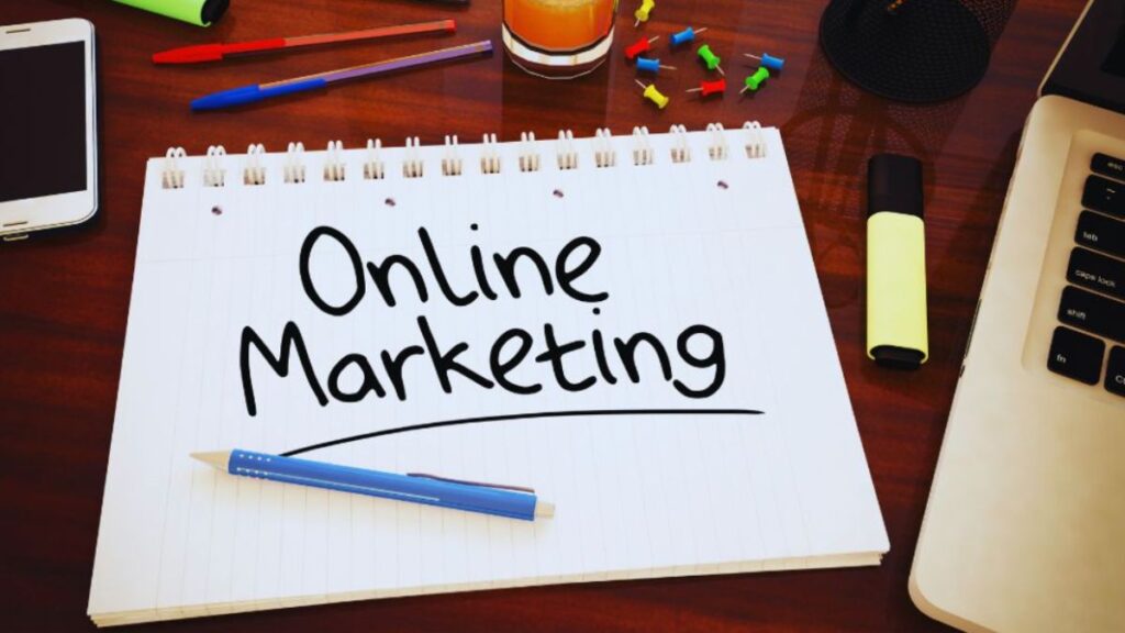 Notebook on a desk with the words “Online Marketing” written on it, surrounded by office supplies, representing online marketing in Palmetto Bay.